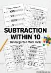Printable picture subtraction within 10 worksheets scattered on a desk.